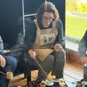 Amy ladling the hot water into the brew cup
